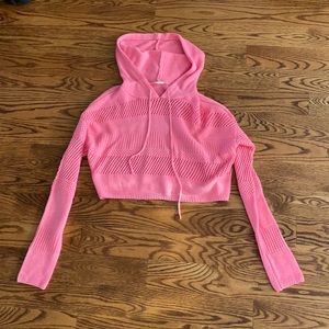 Pink cropped Garage sweater.